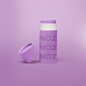 Opened light purple nose sunscreen container in modern purple biodegradable packaging