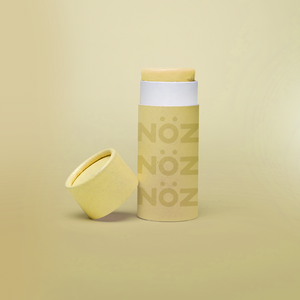 Opened light yellow nose sunscreen container in modern yellow biodegradable packaging